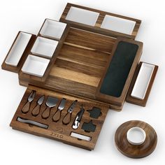 a wooden tray with utensils and plates on it