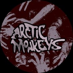 the arctic monkeys logo on a dark background