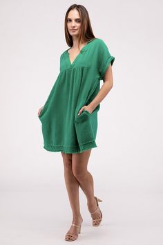 The Gauze Rolled Short Sleeve Raw Edge V-Neck Dress offers a breezy and relaxed style perfect for warm-weather occasions. With its rolled short sleeves and raw edge details, this dress exudes a casual and carefree vibe, making it ideal for summer outings. The V-neck adds a touch of femininity to the look, making this dress a comfortable yet fashionable choice for days at the beach or casual gatherings.Model is wearing a SmallModel SpecsHeight: 5'9"Bust: 35B Waist: 24"Hips: 34"Made in Vietnam Sty Sand Beige, Sheer Fabrics, Kelly Green, Relaxed Style, V Neck Dress, Raw Edge, Warm Weather, Fabric Care, Jumpsuit Dress