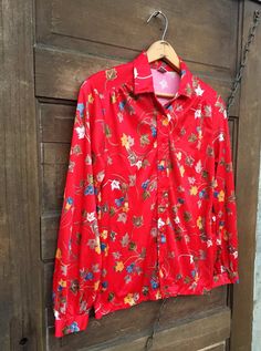 "The most perfect vintage 70's polyester red daffodil and leaf print polyester button down top. Great for fall! No tag. Great vintage condition! Size medium. Measurements laying flat: fabric stretches a bit. Armpit to armpit: 18.5\" Length: 23\" Sleeve length: 22\"" Retro Red Floral Print Shirt, Red Retro Floral Print Shirt, Red Floral Print Retro Shirt, Vintage Red Shirt With Floral Print, Polyester Shirt, Favorite Sweater, Unique Dresses, Leaf Print, Leaf Prints