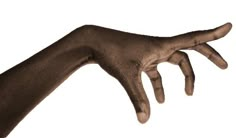 a person's hand reaching out to touch the ground with their left arm, against a white background