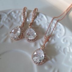 "Crystal Rhinestone Bridal Earrings Rose Gold, Wedding Jewelry, Sparkling Cubic Zirconia Statement Earrings, Luxury CZ Bridal Earrings Beautiful and elegant Dangle Sparkling Teardrop earrings inRose Gold finish are featuring gorgeous delicate Cubic Zirconia Sparkling Teardrops and hooks These are so fabulous looking, really sparkle and shine! Perfect to your wedding day, bridesmaids and the Bride ! * RoseGold framed Teardrops * Rose Gold plated ear hooks with faceted glass cubic stones Rhineston Rose Gold Teardrop Jewelry Sets For Wedding, Rose Gold Crystal Bridal Earrings For Wedding, Rose Gold Teardrop Wedding Jewelry Sets, Sparkling Rose Gold Crystal Earrings For Wedding, Rose Gold Sparkling Bridal Earrings For Wedding, Sparkling Rose Gold Crystal Wedding Earrings, Hand Set Rose Gold Jewelry Sets For Wedding, Rose Gold Round Jewelry Sets For Weddings, Dazzling Rose Gold Jewelry Sets For Wedding