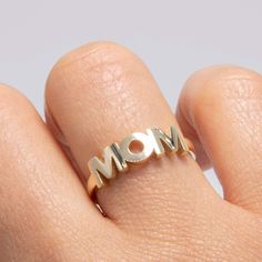 Shiny "MOM" Ring Solid 14K Yellow Gold All Sizes * Metal : Real 14K Gold (Properly Stamped, 14K) * Condition : Brand New * Finish : Polished * Average Weight : Size 7: 1.80 grams * Size : Selectable * Width : 5.5mm x 16.5mm= Just under 1/4" x 5/8" * Clasp/Bail : Can be resized down or up at your local jeweler. All of our items are brand new and are shipped with a gift box. Mom Ring, Average Weight, Stackable Rings, Jewelry Rings, Etsy Accessories, Handmade Items, Accessory Gift, Gift Card, Yellow Gold