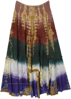 This maxi skirt boasts a stunning display of earth-toned colors and a captivating tie-dye pattern that oozes bohemian charm.  The skirt starts with a warm burgundy waist that seamlessly transitions into soft amber and gold tones, blooming into a deep forest green, with purple at the hem. #tlb #TieredSkirt #vacationclothing #beachwrap #TieDye #TieDyelongSkirt #summerskirt Bohemian Batik Print Beach Skirt, Bohemian Multicolor Mini Skirt, Bohemian Tie Dye Tiered Skirt, Summer Bohemian Batik Print Skirt, Bohemian Batik Print Skirt For Summer, Bohemian Batik Print Summer Skirt, Bohemian Tiered Tie Dye Skirt, Bohemian Festival Skirt With Batik Print, Bohemian Batik Print Skirt For Festival