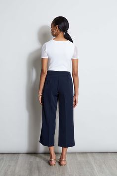 Springs "IT" pant is a chic update to the relaxed wide leg pant. We're obsessed with its cropped length, higher waist silhouette with graphic D-ring belt. Wear it with a knit or layered with a blazer, it will become a favorite in your wardrobe. T-Tahari Crepe Wide Leg Cropped Pant with D-Ring Belt Detail Runs true to Size Model is 5'9" and wearing size 2 Dry Clean Only Imported Style #: THF44003 Chic Tailored Cropped Leg Dress Pants, Chic Tailored Cropped Dress Pants, Elegant Cropped Leg Bottoms For Business Casual, Elegant Cropped Wide Leg Pants For Spring, Chic Cropped Leg Dress Pants For Office, Chic Cropped Leg Dress Pants For Business Casual, Chic Wide Leg Culottes For Business Casual, Versatile Cropped Wide Leg Work Pants, Chic Cropped Wide Leg Pants With Elastic Waistband