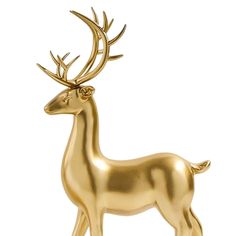 a golden deer figurine on a white background