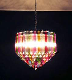 a multicolored chandelier hanging from a ceiling