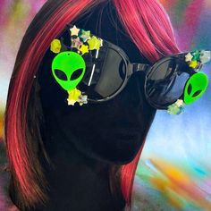 Unleash an out-of-this-world vibe at your next festival with our Get Spacey Alien Festival Sunglasses! These mind-blowing shades, adorned with glow-in-the-dark stars, are designed to transport your style to intergalactic heights. Perfect for festivals and raves, these sunglasses are not just an accessory; they're a statement, a conversation starter, and a ticket to a cosmic adventure under the night sky. - Interstellar Design: Embrace your inner alien with sunglasses featuring glow-in-the-dark s Rave Style Plastic Sunglasses With Uv Protection, Multicolor Tinted Sunglasses For Festivals, Multicolor Tinted Festival Sunglasses, Plastic Sunglasses For Halloween Party, Summer Rave Sunglasses In Plastic, Halloween Party Sunglasses In Plastic, Halloween Party Plastic Sunglasses, Rave Party Sunglasses With Mirrored Lenses, Rave Festival Sunglasses With Tinted Lenses