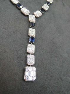 For Sale on 1stDibs - The Following Item we are offering is a Rare 18KT White Gold Large Baguette Diamond Blue Sapphire Necklace. Necklace is comprised of Finely Set Gorgeous Formal Baguette Diamond Necklaces, Luxury Emerald Cut Diamond Necklace For Formal Occasions, Luxury Emerald Cut Diamond Necklace For Formal Events, Luxury Baguette Cut Diamond Necklace, Luxury Formal Necklaces With Baguette Diamonds, Luxury Baguette Diamond Necklace For Evening, Luxury Baguette Diamond Necklaces For Formal Occasions, Luxury Formal Baguette Diamond Necklaces, Elegant Rectangular White Gold Diamond Necklace