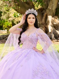 Look radiant in this beaded floral applique long sleeveless cape sleeve dress with an A-line skirt by LizLuo Fiesta 56516. This stunning Quinceañera ball gown is perfect for those who want to feel like a princess. The bodice is made of sheer fabric and decorated with beaded floral lace appliqués, while the skirt is adorned with floral lace appliqués to add the finishing touches. The detachable sleeve cape adds a touch of magic to the dress. House of Wu LizLuo Fiesta Collection Fall 2024 Style Nu Dama Dresses Quinceanera, 1500 Dresses, Wedding Red Carpet, Cape Sleeve Dress, Ivory Bridesmaid Dresses, Detachable Cape, Dama Dresses, Debutante Ball, Sheer Corset