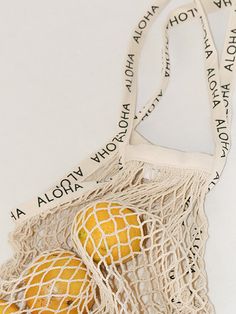 Sport an effortlessly chic look with our Cotton Net Bag. Its lightweight nature and trendy look makes it the perfect accessory to bring to a casual trip to the beach, the market, or to a party! Made with 100% cotton and lined with ALOHA on its straps. Available in 14 different colors! Length: 25.5 in Width: 14 in