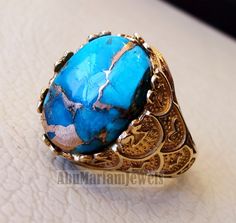 10k gold men ring copper blue turquoise cabochon high quality natural stone all sizes Ottoman signet style fine jewelry fast shipping gold : 10 k gold Approximate Total ring weight : 9 - 10 gram Stone size : 18 mm X 13 mm stamped 10K Nice gift box included . certificate invoice from our shop of weight and gold purity . Risk free Quality guarantee policy : If you are not satisfied with your item for any reason simply send it to us and you will get a replacement or refund . Note that stone stripes Gold Turquoise Cabochon Ring In 14k Gold, Blue Oval Cabochon Turquoise Ring In 14k Gold, Blue Turquoise Oval Cabochon Ring In 14k Gold, Blue Turquoise 14k Gold Oval Cabochon Ring, 14k Gold Blue Oval Cabochon Turquoise Ring, Gold Men Ring, Turquoise Gold Ring, Men Ring, Ring Blue