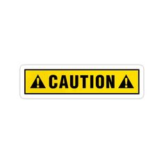 a yellow caution sticker on a white background with the words caution in black letters