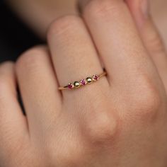 A stacking ring with ruby in 14K solid gold. A dainty 3 stone ring for women with natural gemstones.  100% handcrafted with love! * Material: 14K solid white gold, 14K yellow gold * Gemstone: Ruby, round cut * Gemstone's Weight: 0.06 ct HOW TO ORDER * Choose from the drop-down menus the available options (Ring size, Material) and leave us a note for any special requirements. PRODUCTION TIME - SHIPPING POLICIES * Please keep in mind that each item is handcrafted, and we need 5 days at least for its production. If you need your order on a specific date, please contact us. * All orders are shipped worldwide via FedEx Express for speed and security. The estimated delivery time is 3 days to the US and Europe and 5 days to anywhere else. * All our pieces are delivered beautifully packaged and gi Dainty Stackable 14k Gold Ruby Ring, Dainty 14k Gold Stackable Ruby Ring, Dainty Rose Gold Ruby Ring, Fine Jewelry Ruby Gemstone Stackable Rings, Dainty Stackable Ruby Jewelry, Dainty 14k Gold Three-stone Jewelry, 14k Gold Fine Jewelry Stackable Ruby Ring, 14k Gold Three-stone Emerald Ring As Gift, Dainty Ruby Ring With Rose Cut Diamonds For Promise