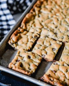 chocolate chip cookie bars cut into squares on a baking sheet