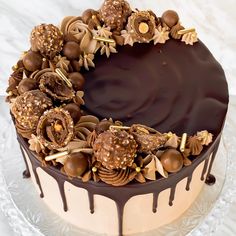 a cake with chocolate frosting and flowers on top