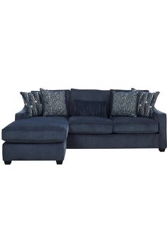 a blue sectional couch with pillows on it