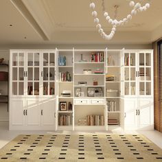 a living room filled with lots of white furniture and bookshelves next to a window