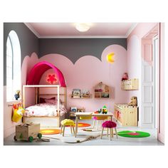 a child's bedroom decorated in pink and yellow with lots of toys on the floor