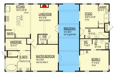 the floor plan for a two story house with an attached garage and living room area