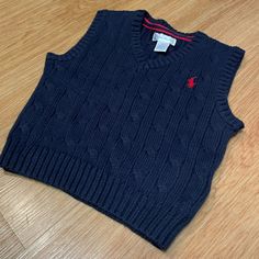 Brand New! Navy Blue Sweater Vest With Red Stitched Logo. Navy Cotton Sweater Vest For Winter, Ralph Lauren Cotton Winter Tops, Blue Cotton Sweater Vest For Winter, Blue Winter Playwear Tops, Blue Winter Tops For Playwear, Blue Tops For Playwear In Winter, Ralph Lauren Blue Winter Tops, Ralph Lauren Blue Winter Sweater, Blue Ralph Lauren Winter Sweater