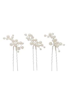 These hair pins turn your big-day 'do into a luminous work of art with gorgeous clusters of imitation pearls that are hand wired in 14-karat-gold plate. Set of three hair pins 2" each Lead-free; nickel-free; cadmium-free Sterling silver with 14k-gold plate/imitation pearl Made in the USA of imported materials Item ships in a gift box Pearl Hair Accessories, Bride Hair Pins, Bride Hair Piece, Hair Accessories Pearl, Summer 2025, Wedding Summer, Wedding Hair Pins, Wedding Hair Pieces, Pearl Hair