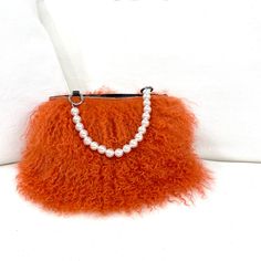 DESCRIPTION:Make a statement and get noticed with our new Fiona Handbag! Unique genuine fur bracelet handbag with pearl handle. Carry on your arm for hands free or hold in your hand. Fully lined with inner pocket. Fun and versatile to dress up a sleek black dress or dress down w jeans and a simple t-shirt; completing your look on an afternoon or night out - even at a wedding! Holds a cell, money, credit cards, glasses, lipstick, keys. • Genuine Italian short fur, Olive Sheepskin or long curly Mo Elegant Faux Fur Winter Bag, Elegant Faux Fur Bags For Winter, Elegant Rectangular Faux Fur Bag, Elegant Faux Fur Bags, Chic Evening Shoulder Bag For Winter, Luxury Faux Fur Evening Bag, Luxury Evening Bags In Faux Fur, Chic Formal Bags With Feather Trim, Elegant Winter Evening Bags