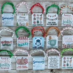 christmas gift tags hanging on a wooden wall