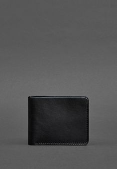 Sophisticated Leather Wallet for Men with a Timeless Design Modern Black Leather Wallets, Modern Trifold Card Holder With Coin Pocket, Black Leather Trifold Wallet For Business, Modern Black Trifold Wallet For Everyday Use, Modern Leather Card Holder For Business, Minimalist Bifold Wallet For Formal Occasions, Modern Leather Business Card Holder, Modern Black Wallets For Business, Black Minimalist Trifold Wallet For Everyday Use