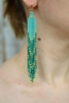 Extra long beaded fringe earrings, Turquoise emerald green gold tassel seed beaded earringsWhole length : 5.8" (14.5 cm)❤ CUSTOM ORDERSIt is ABSOLUTELY HANDMADE . So if you like this item in a different color or size, send me a message please. I will send you a link for a "custom order" and you'll be able to place the order there. Please feel free to communicate with me.SHIPPINGItem will be shipped carefully packed in a GIFT BAG!! Shipping cost includes tracking number!-If item is ready to ship Green Chandelier Earrings With Dangling Beads For Festivals, Green Dangle Chandelier Earrings For Festival, Turquoise Beaded Fringe Tassel Earrings For Festival, Green Tassel Earrings With Fringe For Festivals, Turquoise Tassel Earrings With Round Beads, Turquoise Tassel Drop Earrings With Colorful Beads, Turquoise Tassel Earrings With Colorful Beads, Green Bohemian Beaded Earrings With Tiny Beads, Green Bohemian Chandelier Earrings With Dangling Beads