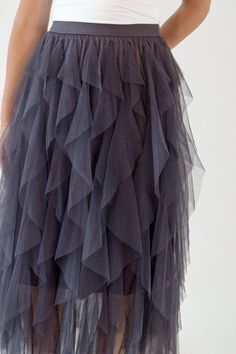 Get ready to twirl in style with our Ash Tulle Skirt! This dreamy piece combines sophistication with a playful twist, making it the perfect addition to your wardrobe. The spiral ruffled design adds a touch of whimsy, while the elegant ash hue ensures a versatile and timeless appeal. Why You'll Love It: Spiral Ruffles: Layers of ruffles create a mesmerizing and dynamic look, perfect for making a statement. Elegant Ash Color: A neutral shade that pairs effortlessly with any top, from casual tees t Layered Tulle Skirt, Holiday Shoes, Casual Tees, The Spiral, Ash Color, Casual Tee, Skirt Top, Get Ready, Dress Collection