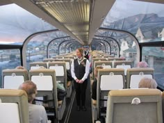 a man standing on the inside of a bus