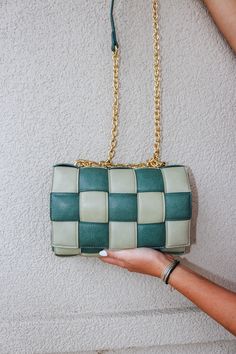 Treat yourself to a stylish new purse that's as green as it is gorgeous. The Quilt Leather Green Purse is made from luxe leather and hangs from a crossbody chain, so you can show off your chic style without sacrificing comfort. Ah, it's a match made in fashion heaven! Green Purse, Match Making, Quilted Leather, Treat Yourself, In Fashion, Chic Style, Purse, Chain, Green