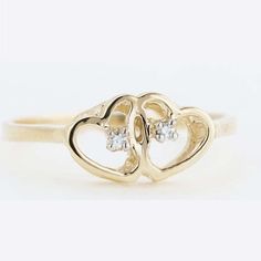 Best Price | Fine Jewelry | Double Heart Ring women's ring, intertwined with symbolism. This delightful ring denotes affection, romantic adoration and love. Symbolizing never ending romantic love, togetherness and unity. A designer setting in solid 14k yellow gold delivers with double shimmering diamonds. Dainty Double Heart Promise Jewelry, Elegant Double Heart Jewelry For Promise, Elegant Double Heart Promise Jewelry, Classic Double Heart Promise Jewelry, Diamond Open Heart Promise Ring, Valentine's Day Open Heart Ring With Diamond Accents, Fine Jewelry Open Heart Diamond Promise Ring, Dainty Double Heart Promise Ring, Double Heart Diamond Ring With Brilliant Cut