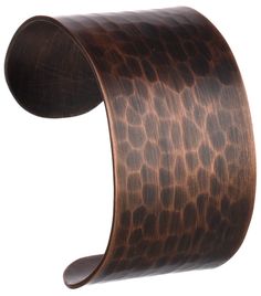 an animal print leather cuff bracelet on a white background