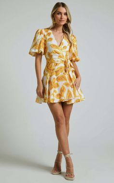 Aleka Mini Dress - V Neck Balloon Sleeve Wrap in Sunshine Floral | Showpo USA Summer V-neck Wrap Dress For Brunch, Summer Wrap Dress With Surplice Neckline For Day Out, Spring Beach Wrap Dress With Surplice Neckline, Chic Beach Wrap Dress With Surplice Neckline, Summer Wrap Mini Dress With Tie Waist, Flirty Spring Wrap Dress With Tie Waist, Summer Wrap Dress For Day Out, Spring Wrap Dress For Day Out, Flirty Tie Waist Wrap Dress For Brunch