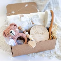 a teddy bear and other items in a box