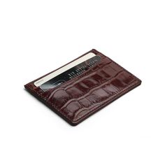 This luxury card holder, made from exquisite Italian cow leather with a crocodile pattern, is a true statement piece. The burgundy color enhances its refined appeal. Specifications: • Material: Italian cow leather with crocodile pattern• Color: Burgundy• Size: 10 x 7.3 cm (3.94 x 2.87 inches)• Structure: 4 credit card slots and one top pocket Luxury Burgundy Leather Wallet, Elegant Burgundy Wallet With Card Slots, Elegant Burgundy Wallet With Interior Card Slots, Elegant Brown Card Holder For Formal Occasions, Elegant Brown Formal Card Holder, Elegant Brown Business Card Holder, Elegant Brown Card Holder With Slots, Formal Rectangular Card Holder With Crocodile Pattern, Formal Crocodile Pattern Rectangular Card Holder