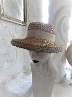 "STYLISH BEIGE 60's SUN HAT This stylish hat is a fashion statement that would work for any era--a good choice for an afternoon garden party, wedding or day at the races...or a stroll down the sidewalk! It is well made despite no maker's label, in a color that will go with almost anything. It has a hatband of beige with a 2 tone grosgrain ribbon in brown and beige at the back and would be ideal for brown spectator pumps. A vintage treasure to last another lifetime or 2! Very good to excellent co Vintage Fitted Brimmed Panama Hat, Retro Summer Hat With Curved Brim, Vintage Panama Hat With Curved Brim, Vintage Cream Hat Bands With Flat Brim, Retro Wide Brim Sun Hat For Summer, Retro Brimmed Sun Hat For Vacation, Retro Brimmed Sun Hat For Summer, Retro Wide Brim Summer Hat, Adjustable Vintage Natural Hat Band