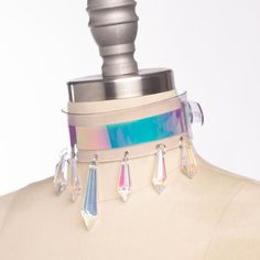 Magical, color-shifting iridescent oversized choker collar made in thick PVC. Holographic, iridescent pvc is layered over clear or white PVC.  Seven (7) aurora borealis glass crystal points adorn the front. The center crystal is 2" and the others are 1". Fit is adjustable with buckle in back.  Inspired by Sailor Moon and Magical Girls!Collar is 1.5" wide.Available in white or clear.SMALL/MEDIUM (11-13")MEDIUM/LARGE (13-15")LARGE/X-LARGE (15-17")Custom sizing available.  All pieces are MADE TO OR Holographic Accessories, Space Babe, Holographic Fashion, Posture Collar, Holographic Iridescent, Gamine Style, Holographic Vinyl, Iridescent Crystal, 90s Aesthetic