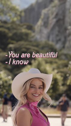 a woman wearing a cowboy hat and pink shirt with the words you are beautiful i know