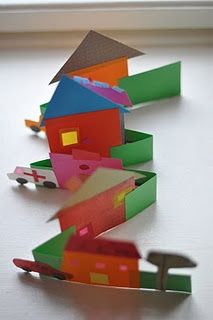 an origami house is shown on the table