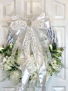 ✋🏿 handmade  Wedding Wreath for Front Door, Bridal Wreaths for Front Door, Bridal Shower Wreath, Bridal Shower Welcome, Wedding Welcome, Spring Wedding Wreath, Summer Wedding Wreath, XL Wedding Wreath, Xl Bridal Shower Wreath, Elegant Wedding Wreaths for Front Door, mother of the bride, gift wreath  This beautiful Wedding Wreath or any occasion wreath is perfect due to its versatility and beauty. As a wedding wreath, mother of the bride , as a gift for someone special it's just perfect.  This Beautiful Wedding/Bridal Wreath screams out Elegance!!  The perfect touch of white Roses, baby breath and greenery spread throughout the wreath. A bow made from satin finished with a beautiful brooch. Wow!  This beautiful and elegant Wedding/Bridal Wreath will certainly bring elegance to your door, w Bridal Shower Wreaths, White Floral Wreath, Bridal Wreath, Gift Wreath, Mother Of The Bride Gift, Wedding Wreath, Baby Breath, Wedding Wreaths, Wreath Summer