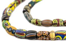 WOW! Take a look at this beautiful antique strand of Venetian Millefiori trade beads! Celebrated among the most distinctive of beads, the Millefiori has become nearly synonymous with the West African Trade. Made from famed Murano glass, Millefiori beads derive their name from the Italian words for “Thousand Flowers” due to the characteristic floral motifs that decorate their surface. Millefiori beads were made throughout the 19th and 20th century primarily for export to Africa. Today they are fo Antique Multicolor Handmade Beads, Vintage Multicolor Multi-strand Beads, Trade Beads Antique, Vintage Glass Oval Beads, Italian Words, Bohemian Murano Glass Beads, Colorful, Fancy Beads, African Trade Beads, Trade Beads