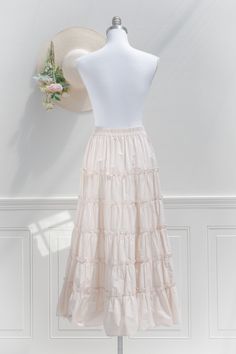 An elegant-yet-versatile skirt perfect for mixing-and-matching, the 100% cotton Antoinette skirt in cream features tiers accented with ruffles, a comfortable elastic waistline, and flowy silhouette made for twirling! . Details: S: Waist 26"-32", Length 35" M: Waist 28"-34", Length 35.5" L: Waist 30"-36", Length 36" Elastic Waistline Material: 100% Cotton Unlined Care: Hand Wash Cold / Hang Dry Imported Ships in 1 to 2 Business Days Free US Shipping on Orders over $100 Cottagecore Skirt Outfit, Outfit Basics, Cottagecore Skirt, Cream Skirt, Cottagecore Outfits, Cotton Midi Skirt, French Girl Style, Skirt Outfit, French Girl