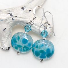 A pair of handmade artisan glass, Swarovski crystal and silver earrings. All metal parts are high quality sterling silver. They measure approx. 3.6cm long. All of the lampwork beads in my shop were made by me in my home studio in Sydney and have been annealed in my digital kiln to remove stress and prevent cracking. I do my best to take quality photos that show items clearly and as true to color as possible, however please understand that different computer monitors can display colors differentl Silver Dangle Glass Earrings, Clear Round Sterling Silver Earrings, Nickel-free Czech Glass Crystal Earrings For Gift, Nickel-free Czech Glass Crystal Earrings As Gift, Nickel-free Sterling Silver Clear Earrings, Clear Glass Earrings As A Gift, Nickel Free Sterling Silver Clear Earrings, Clear Glass Earrings For Gift, Clear Glass Earrings For Gifts