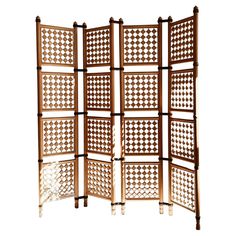 a room divider made out of wood and lattices