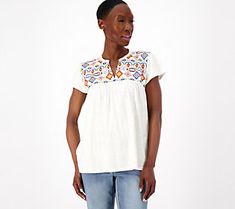 An intricate Southwest-inspired pattern gives this embroidered top its standout style. Pair it with capri jeans and flat sandals for a casual daytime look that exudes Bohemian charm. From Canyon RetreatTM. Casual Embroidered V-neck Top For Fall, Casual V-neck Embroidered Top With Multicolor Embroidery, Summer V-neck Top With Geometric Embroidery, Casual V-neck Top With Multicolor Embroidery, Casual V-neck Blouse With Embroidered Neckline, Casual V-neck Blouse With Geometric Embroidery, Casual Embroidered Short Sleeve Top For Spring, Casual V-neck Top With Floral Embroidery, Casual Embroidered Fall Blouse