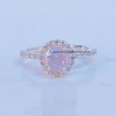 "Snowflake Rose Quartz Ring-Round Shaped-Gold Ring-Silver Ring-Delicate Ring-Stacking Ring-Promise-Anniversary Ring for Women-birthday Gift Specifications :- ❥ Stone - Natural Rose Quartz ❥ Stone Size - 6x6mm  ❥ Cut Type - Round ❥ Side Stones- Simulated diamonds Cz ❥ Ring Size: I offer more than one (Contact us if your ring size is not available in the listing) ❥ Color: Silver, Gold, Rose Gold, White Gold or Black Rhodium ❥ Material : 925 Sterling Silver, 14K/18K/22K Solid Gold --> ❥ Makes a Wonderful Gift for your Girlfriend, Wife, Mother and Friend or Simply an Excellent Addition to Your Jewelry Collection -->IF YOU WANT CUSTOM ENGRAVING ON YOUR RING VISIT OUR LISTING HERE: It's Only 2 USD https://www.etsy.com/listing/1436332485/custom-engaraving - -Here's a link to my HOMEPAGE: Johrifin Dainty Cluster Ring With Halo Setting, Pink Cluster Ring Gift, Round Halo Ring, Gift, Round Halo Ring, Perfect Gift, Gift Halo Stackable Rings With Round Cut, Silver Delicate Promise Birthstone Ring, Anniversary Crystal Ring With Halo, Delicate Silver Birthstone Promise Ring, Delicate Silver Jewelry With Halo Design