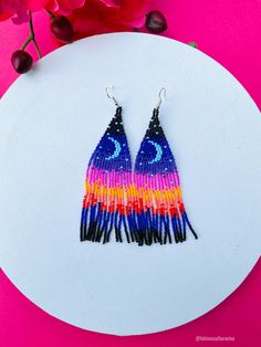 These beautiful beaded earrings are so colorful and perfect for all-day wear. They are definitely the perfect accessory to style up your look and add personality to your outfit. These lovely handmade earrings are made with sterling silver hooks and colorful beads. Each pair of earrings that we sell is authentic and one-of-a-kind! Finds more styles at https://www.etsy.com/shop/LatinxsCulturaViva?ref=simple-shop-header-name&listing_id=990207426&section_id=26730499 Thank you so much for vis Multicolor Beaded Flower Drop Earrings, Multicolor Beaded Drop Flower Earrings, Beaded Multicolor Flower Earrings For Summer, Multicolor Beaded Flower Earrings For Summer, Summer Multicolor Beaded Flower Earrings, Adjustable Multicolor Flower Earrings With Colorful Beads, Artsy Adjustable Beaded Earrings With Colorful Beads, Multicolor Beaded Flower Earrings For Festivals, Multicolor Round Beads Flower Earrings For Gift